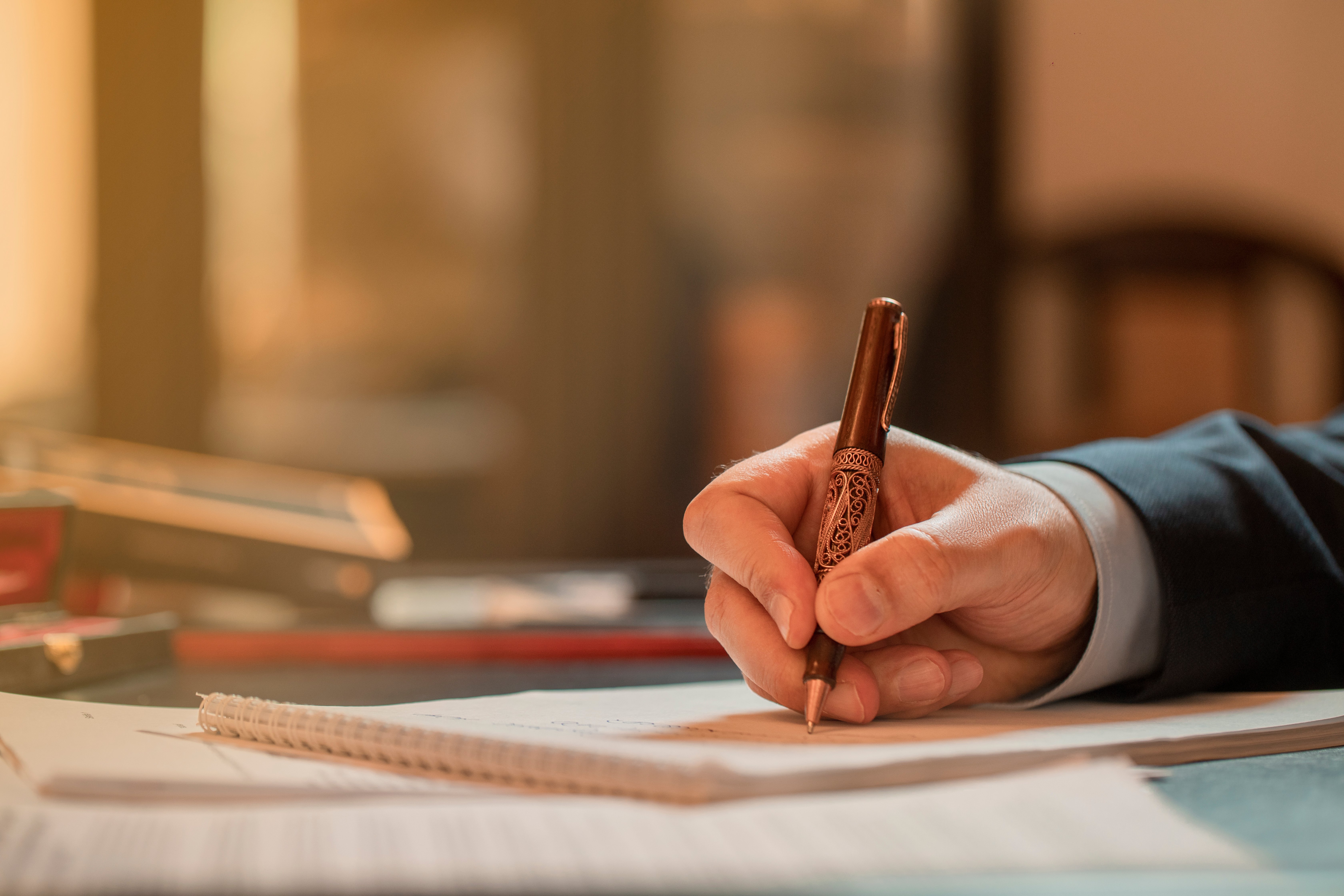director-signing-documents-with-fashion-pen-high-quality-photo